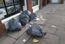Bags spewing disgusting rubbish blighting major city street
