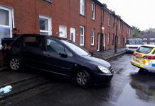 Car drives into house