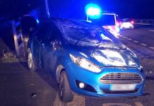 Car flips over on major route