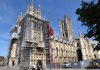 Woman clambers on to Cathedral scaffolding
