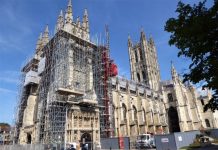 Woman clambers on to Cathedral scaffolding