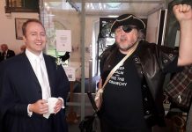 Eye-patched pirate with samurai sword attends civic ceremony